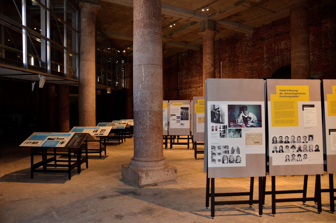 Parts of the exhibition set up with several large-format panels in a large room.